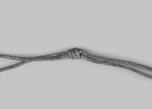 Grey cord with a tight knot in it